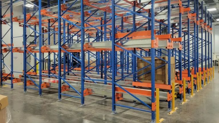 Pallet shuttle system compared to drive-in racking in warehouse